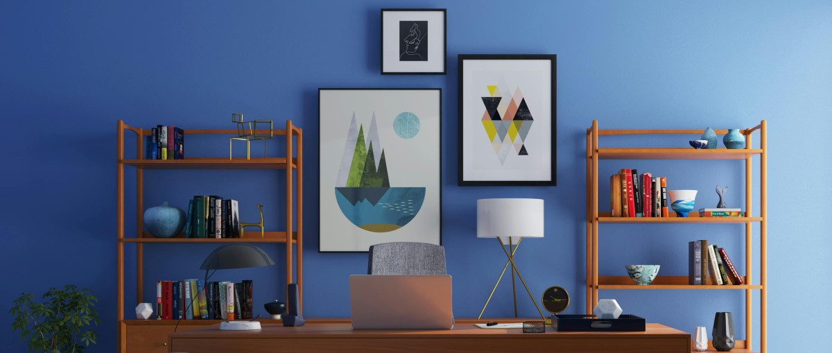 An image of framed printed products on a home office wall