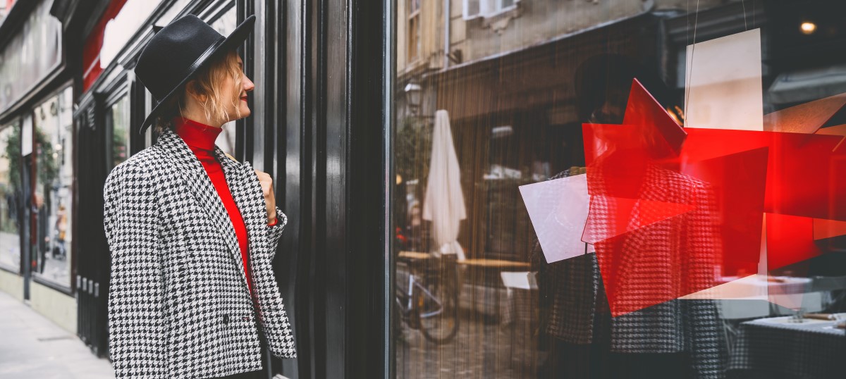 A woman admires a window graphics pattern