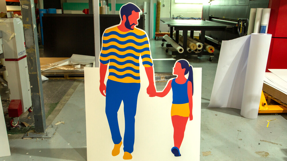 A cut-out or standee made from a type of rigid display board.